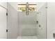 Modern shower with sleek glass doors, white penny tile, and contemporary fixtures, offering a spa-like experience at 4925 E Red Rock Dr # 43, Phoenix, AZ 85018