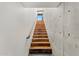 Modern stairway features wood treads, concrete wall accents, and a minimalist design with natural light at 4925 E Red Rock Dr # 43, Phoenix, AZ 85018