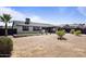 Large backyard with desert landscaping, a patio, pergola, and an outdoor cooking area at 6802 S 44Th Pl, Phoenix, AZ 85042