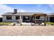 Spacious backyard featuring an outdoor kitchen, jacuzzi, and landscaped area with desert plants at 6802 S 44Th Pl, Phoenix, AZ 85042