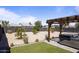 Expansive backyard with mature desert landscaping, covered patio and a relaxing jacuzzi at 6802 S 44Th Pl, Phoenix, AZ 85042