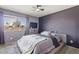 Bedroom featuring ceiling fan and dresser at 6802 S 44Th Pl, Phoenix, AZ 85042