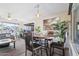 Open-concept dining area next to living room featuring stylish decor and abundant natural light at 6802 S 44Th Pl, Phoenix, AZ 85042