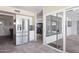 Kitchen area with stainless steel refrigerator and access to sun room at 6802 S 44Th Pl, Phoenix, AZ 85042