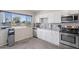 Bright kitchen with a large window and stainless steel appliances at 6802 S 44Th Pl, Phoenix, AZ 85042