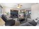 Comfortable living room with a ceiling fan, stylish furnishings, and plenty of natural light at 6802 S 44Th Pl, Phoenix, AZ 85042