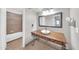 Bathroom with an old-fashioned vanity featuring a unique vessel sink and updated fixtures at 750 E Northern Ave # 2006, Phoenix, AZ 85020