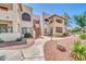 Inviting condo building with well-maintained landscaping and walkways on a bright sunny day at 750 E Northern Ave # 2006, Phoenix, AZ 85020