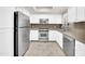 Bright kitchen featuring stainless steel appliances, granite countertops, and white cabinetry at 750 E Northern Ave # 2006, Phoenix, AZ 85020