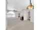 Spacious living area featuring a fireplace, ceiling fan, arched window and neutral decor at 750 E Northern Ave # 2006, Phoenix, AZ 85020