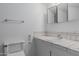 Well-lit bathroom with standard white fixtures including a sink, vanity, and a tiled countertop at 8211 E Garfield St # J219, Scottsdale, AZ 85257