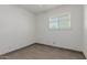 Bright bedroom featuring a window with blinds and a tile floor at 8211 E Garfield St # J219, Scottsdale, AZ 85257