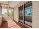 Enclosed patio with a sliding glass door and screen at 8211 E Garfield St # J219, Scottsdale, AZ 85257