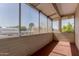 Enclosed patio featuring screened windows and a concrete floor at 8211 E Garfield St # J219, Scottsdale, AZ 85257