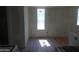Sunlit kitchen space featuring an open space with a half-wall and tile floors, ready for updates at 8838 N 8Th St # 105, Phoenix, AZ 85020