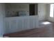 A living room and kitchen space with fresh paint, updated flooring, and modern fixtures at 8838 N 8Th St # 105, Phoenix, AZ 85020