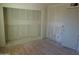 Bright living room with fresh drywall and wood floors at 8838 N 8Th St # 105, Phoenix, AZ 85020