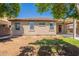Home's backyard featuring a pergola-covered patio and an expansive garden area, perfect for relaxation and entertainment at 888 S 165Th Ln, Goodyear, AZ 85338