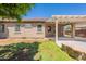 Home exterior view highlighting the covered patio, blending indoor comfort with outdoor charm at 888 S 165Th Ln, Goodyear, AZ 85338