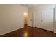 Bedroom with closet doors and an open door to the next room at 888 S 165Th Ln, Goodyear, AZ 85338