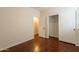 Empty bedroom with a closet and an open door to the next room at 888 S 165Th Ln, Goodyear, AZ 85338