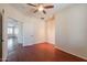 Bedroom featuring an open door and wood floors at 888 S 165Th Ln, Goodyear, AZ 85338