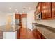 Well-equipped kitchen featuring a breakfast bar, granite countertops and stainless steel appliances at 888 S 165Th Ln, Goodyear, AZ 85338