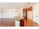 Spacious kitchen island with stainless steel sink and granite countertops, perfect for meal prep and entertaining at 888 S 165Th Ln, Goodyear, AZ 85338