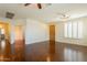 Spacious living room with stained concrete floors and plantation shutters at 888 S 165Th Ln, Goodyear, AZ 85338