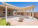 Shaded patio offering comfort and style with pergola, seamlessly integrated into the backyard's design at 888 S 165Th Ln, Goodyear, AZ 85338