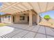 Enjoy this large, covered patio featuring a pergola, creating a seamless transition to the backyard at 888 S 165Th Ln, Goodyear, AZ 85338