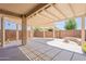 Spacious covered patio offers shade and an outdoor living space with pergola and concrete pavers at 888 S 165Th Ln, Goodyear, AZ 85338