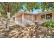 Backyard with screen enclosed patio attached to the home, featuring trees and barbeque at 10205 W Royal Oak Rd, Sun City, AZ 85351