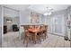 Cozy dining area featuring a wood table, chairs, and easy access to other rooms at 10205 W Royal Oak Rd, Sun City, AZ 85351