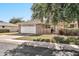 Inviting single-story home featuring a well-kept lawn and a brick facade near the entry at 10205 W Royal Oak Rd, Sun City, AZ 85351