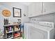 Functional laundry room with washer, dryer, storage and utility sink at 10205 W Royal Oak Rd, Sun City, AZ 85351