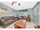 Comfortable living area with a large window and tile flooring at 10205 W Royal Oak Rd, Sun City, AZ 85351