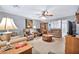 Spacious living room with neutral walls, plush seating, and a view into the adjacent room at 10205 W Royal Oak Rd, Sun City, AZ 85351