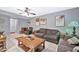 Inviting living room featuring neutral tones, comfortable seating, and natural light at 10205 W Royal Oak Rd, Sun City, AZ 85351