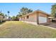 Exterior view of a home with a private side yard and a two-car garage at 10205 W Royal Oak Rd, Sun City, AZ 85351