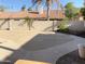 Spacious backyard featuring a beige patio and a large covered pool at 1249 E Commerce Ave, Gilbert, AZ 85234