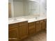Bathroom features a double sink vanity and a large mirror at 1249 E Commerce Ave, Gilbert, AZ 85234