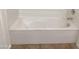 Clean white bathtub with sleek fixtures providing a relaxing soaking experience at 1249 E Commerce Ave, Gilbert, AZ 85234