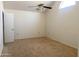 Cozy bedroom with neutral carpet, ceiling fan, and natural light at 1249 E Commerce Ave, Gilbert, AZ 85234