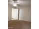 Comfortable bedroom with carpet, ceiling fan, and closet at 1249 E Commerce Ave, Gilbert, AZ 85234