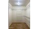 Walk-in closet providing ample storage space with adjustable shelving at 1249 E Commerce Ave, Gilbert, AZ 85234