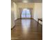 Bright dining area featuring hardwood floors, large windows, and a chandelier at 1249 E Commerce Ave, Gilbert, AZ 85234