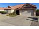 Exterior home view highlighting the driveway and garage of this well-kept single-story home at 1249 E Commerce Ave, Gilbert, AZ 85234
