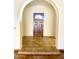 Inviting entryway with a decorative tile landing and a dark wood door with a decorative window at 1249 E Commerce Ave, Gilbert, AZ 85234