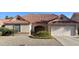 Charming single-story home with a well-maintained front yard, tile roof, and an attached garage at 1249 E Commerce Ave, Gilbert, AZ 85234
